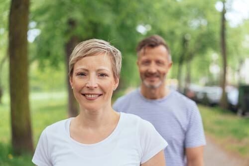 man and woman use exercise walk to prevent varicose vein