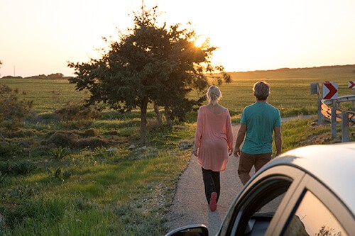 couple takes walk stretches during long car trip break coachella valley
